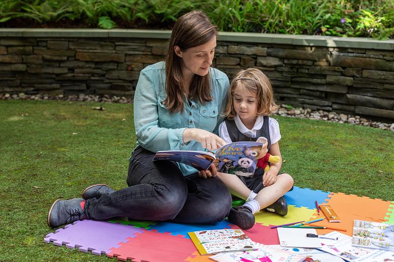 Parent and child reading Five Bears from the Bookbug P1 Family Bag 2023